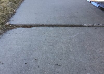 sidewalk that needs to be leveled - colorado