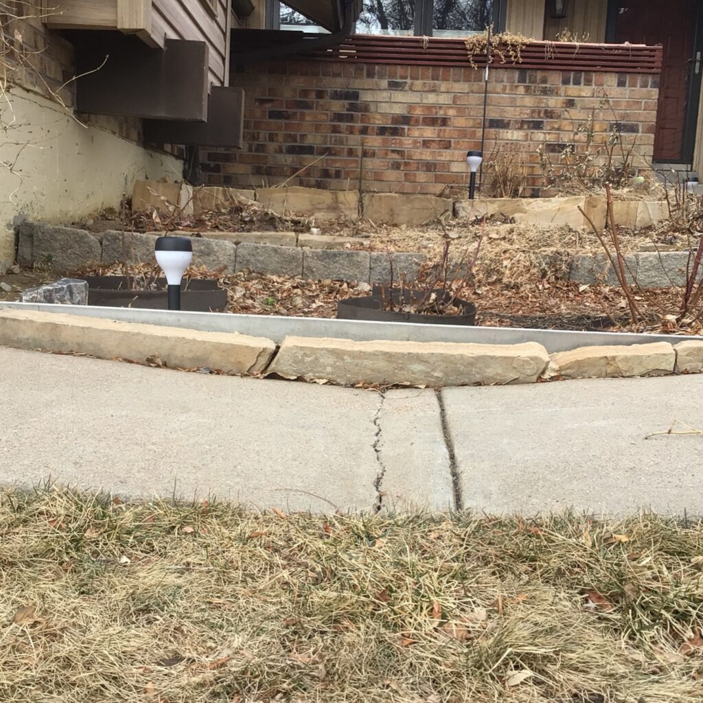 signs you need concrete leveling - sinking walkway