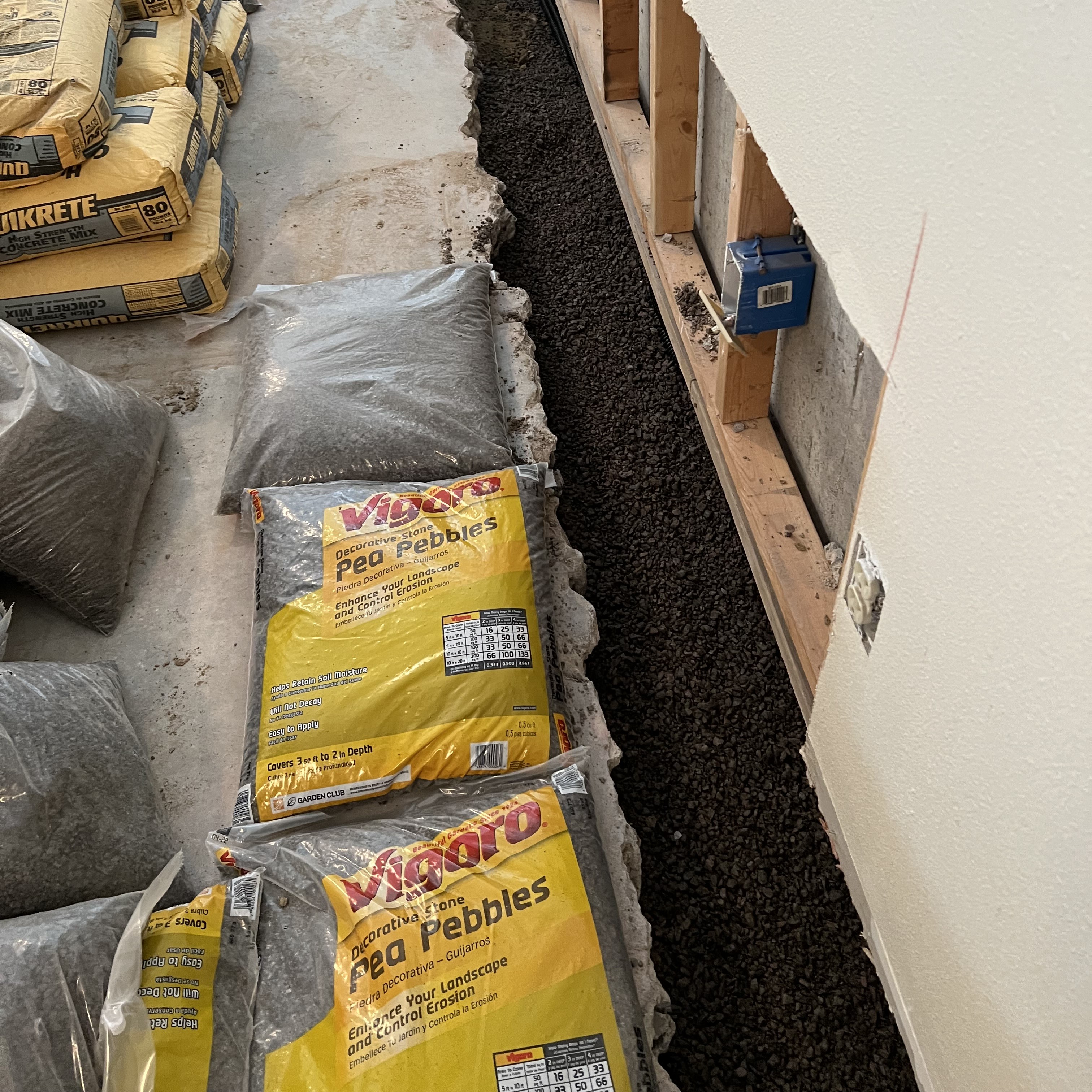 Basement Waterproofing - Drain Trench Filled With Pea Rock